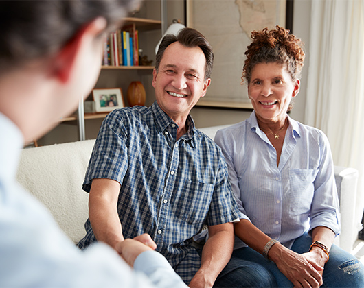 couple meeting with financial advisor to discuss their retirement income strategy