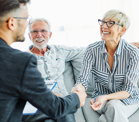 financial advisor meeting with couple to discuss keys to a successful retirement