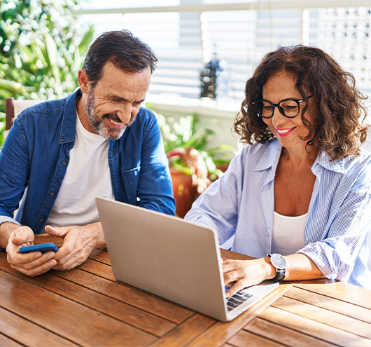 couple on computer researching annuity for retirement